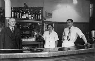 Interior view of the Ben Cleuch with John and Jimmy Simpson and barmaid Betty.